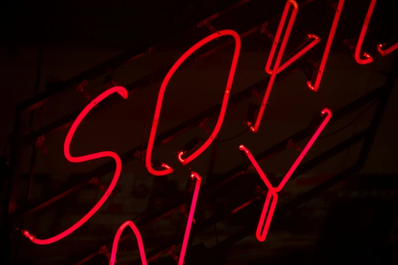 this neon sign is reading sorry to you