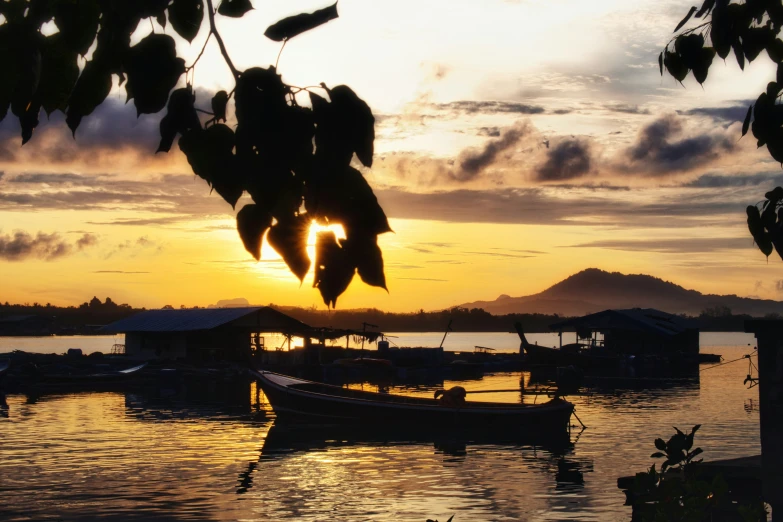 boats on the water during a sunset