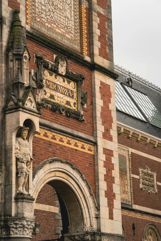 a tall brick building with ornate details at the top