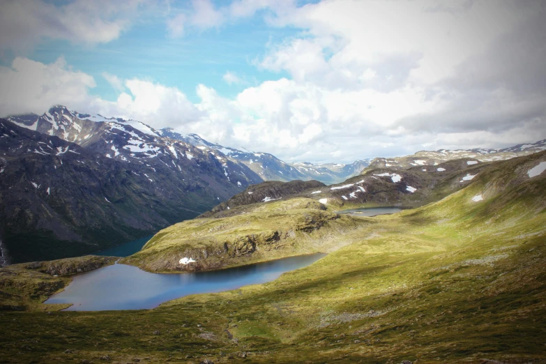 a lake in the middle of a mountainous valley