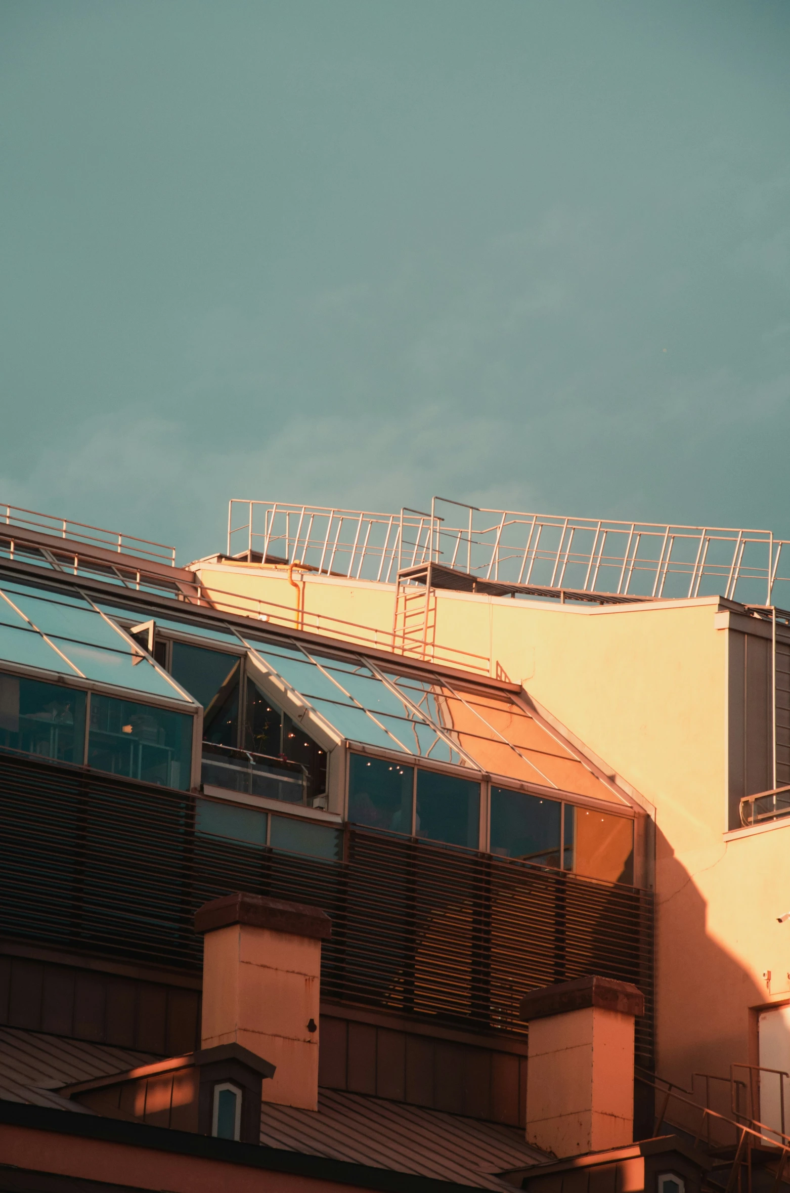 an image of a plane flying above some buildings