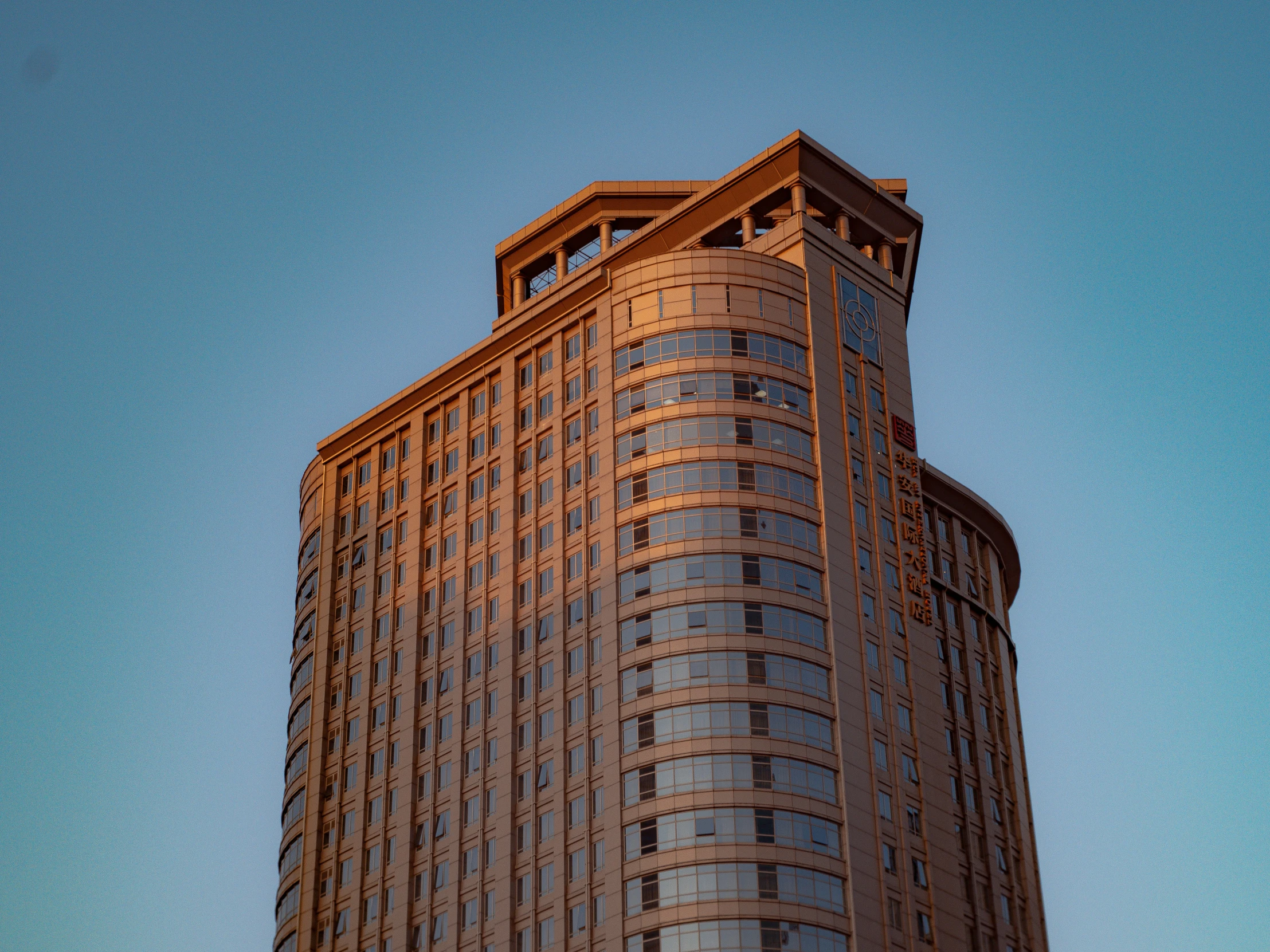 a large brown building sitting on the corner of the street