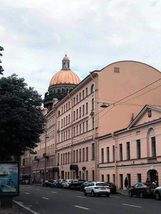 a row of building with a domed clock on top