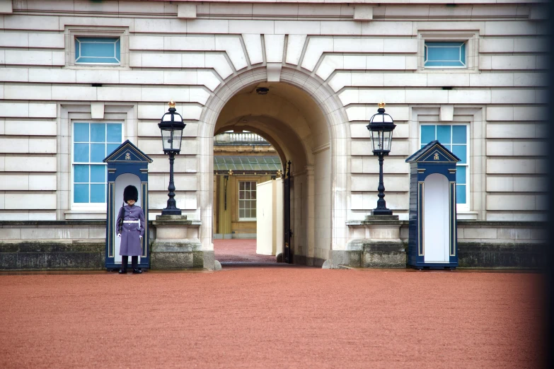 the doorway to the white building is decorated with blue trim