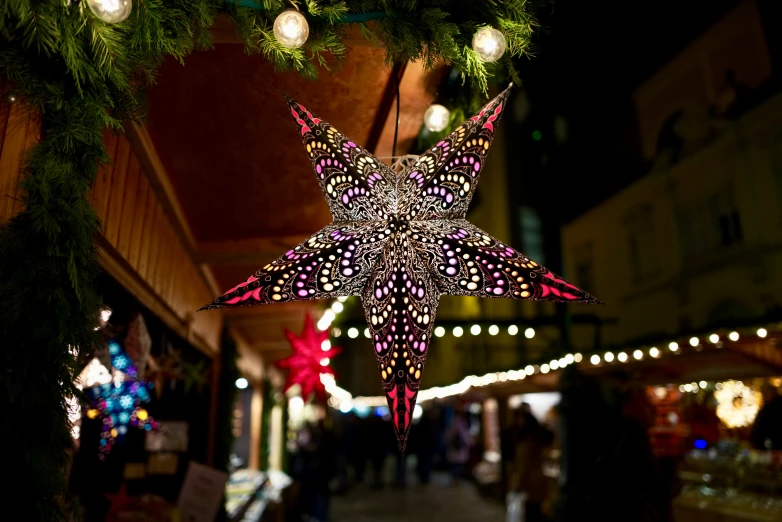 lights hang from nches and decorated on a city street