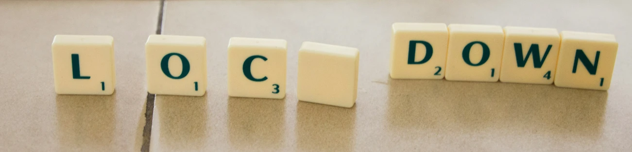 word blocks spelling lockdown on a table