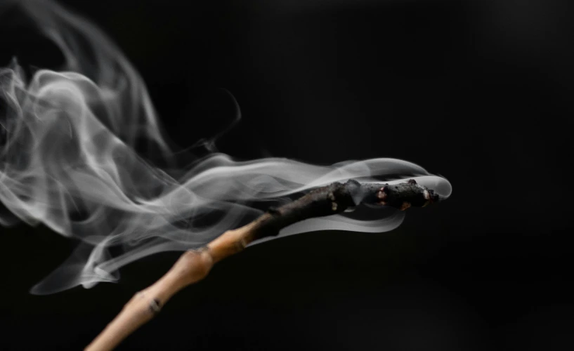 a stick is wrapped in smoke, which appears to be very long