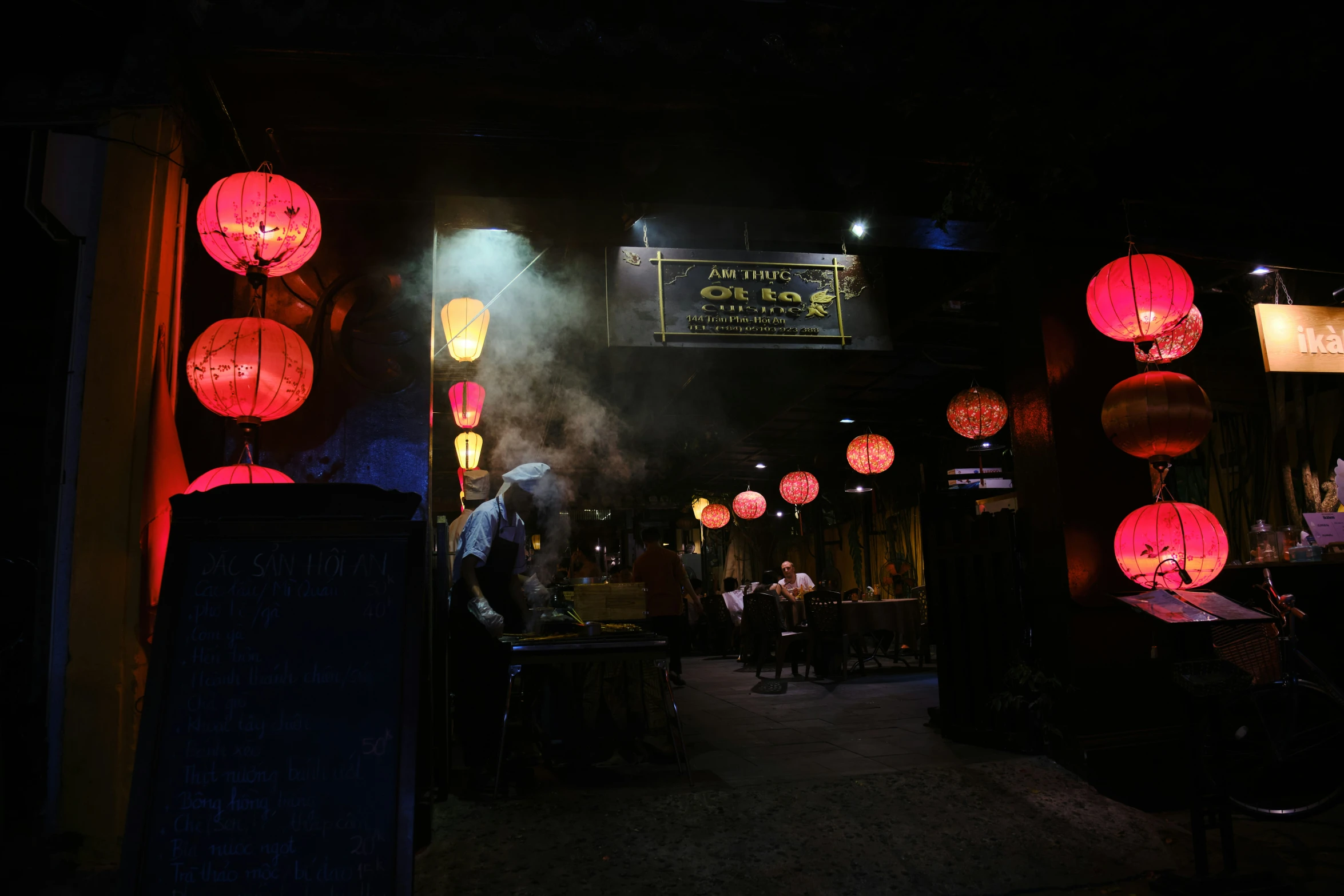 oriental lanterns in the dark with smoke coming out