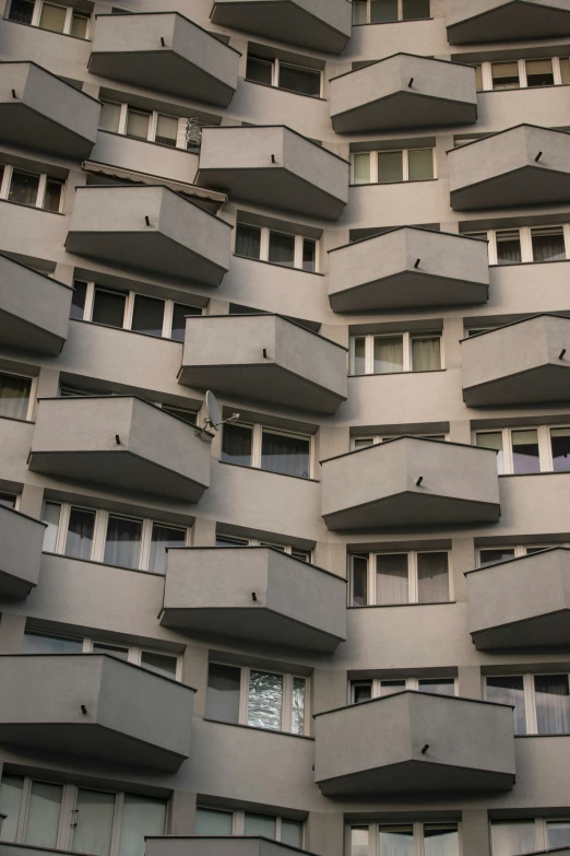 a very tall and tall building with balconies on the top