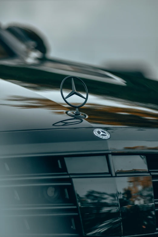 the mercedes benz logo is displayed on the hood