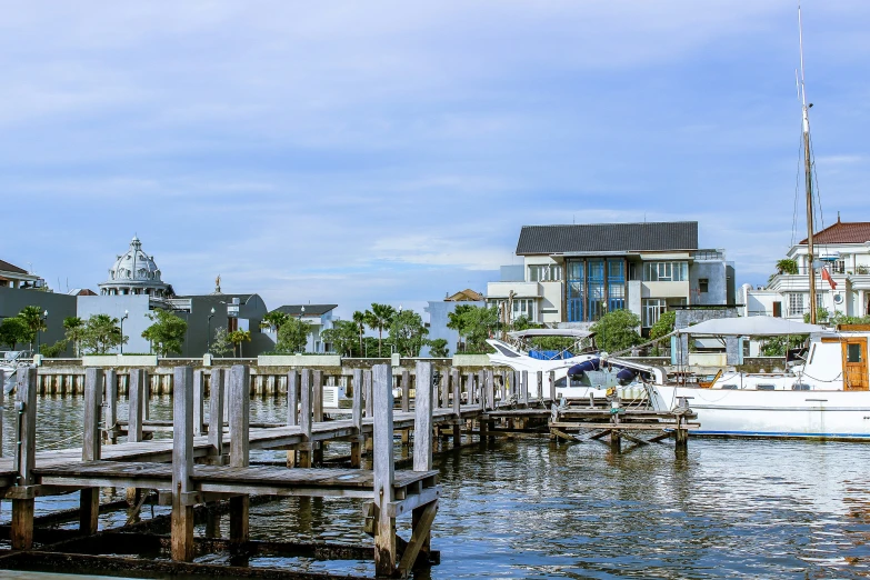 boats are in the water near a dock