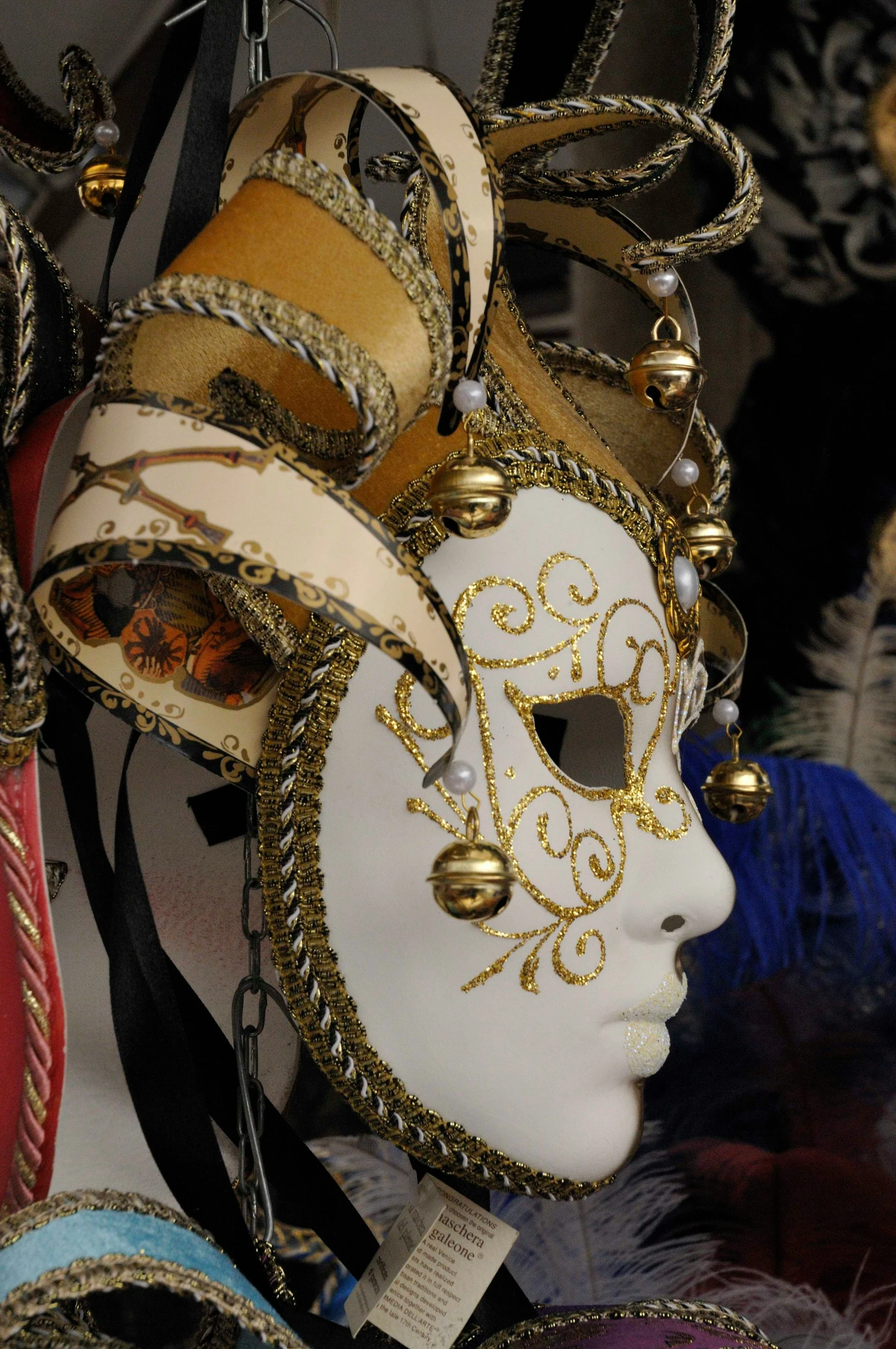 a masked mask with gold ornaments around its eyes