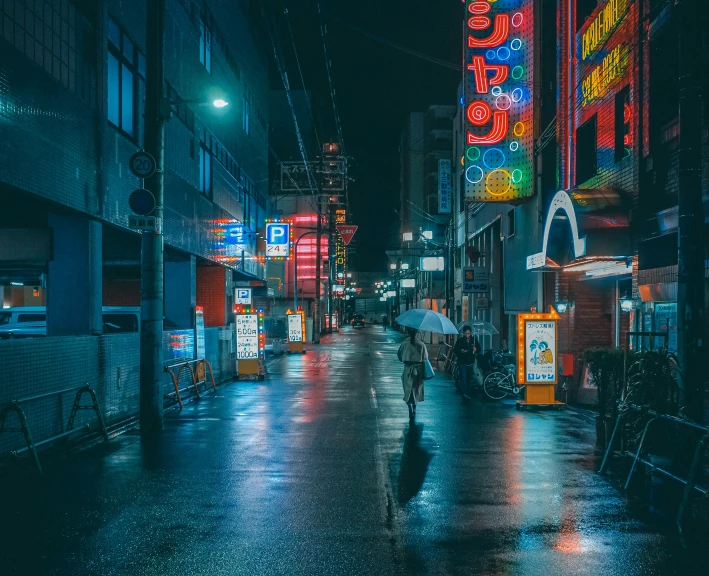 some people standing in the street next to a building