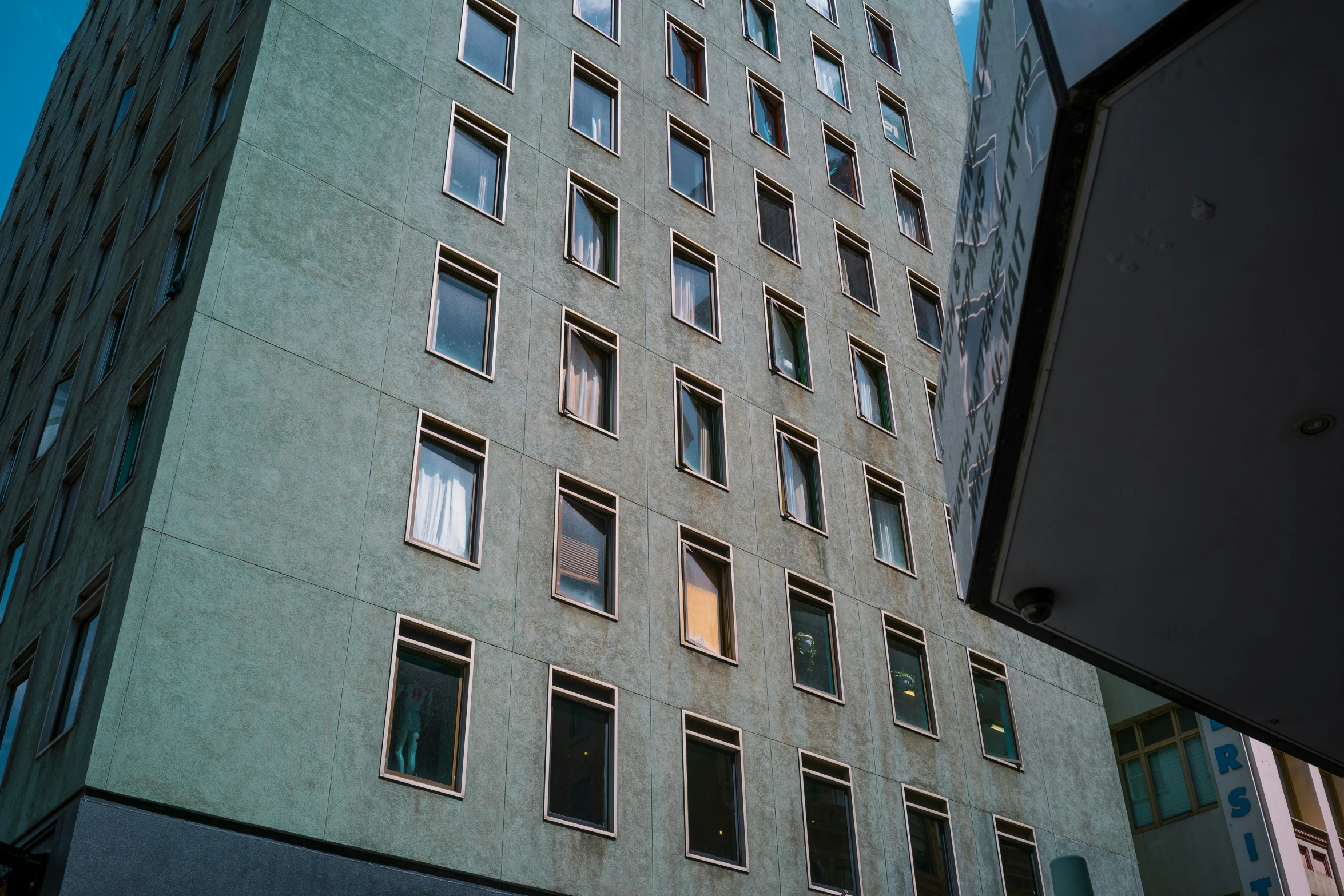 the front of a building that has multiple windows