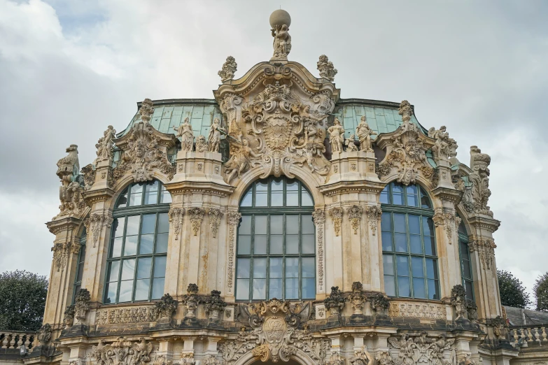 a large old building with a statue on top of it