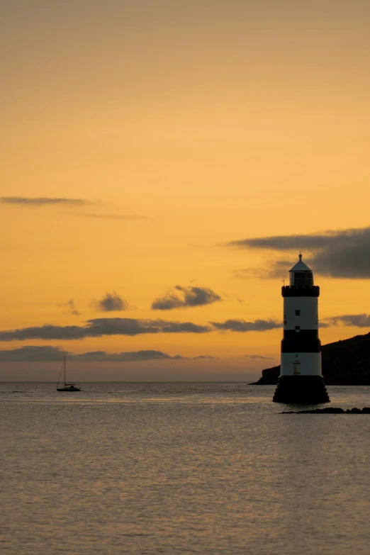 an image of a lighthouse that is in the water