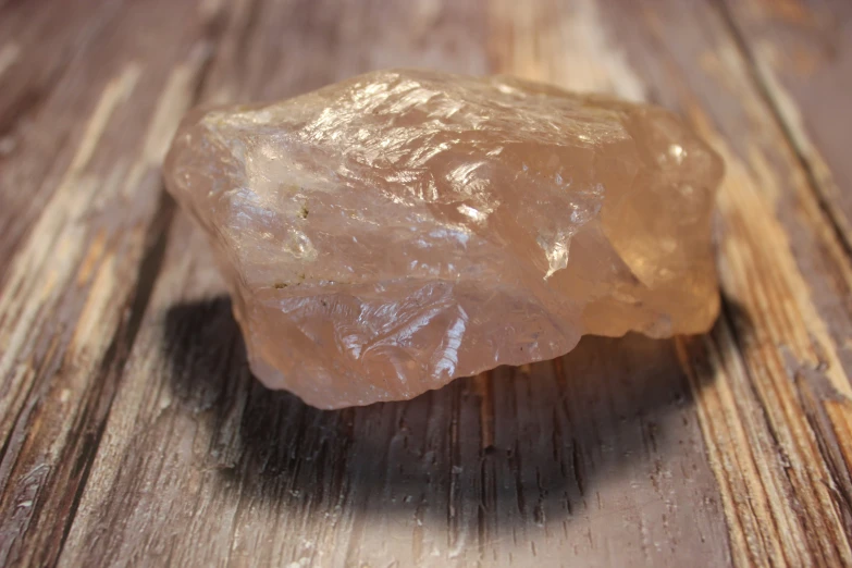 a small piece of brown rock sitting on a table