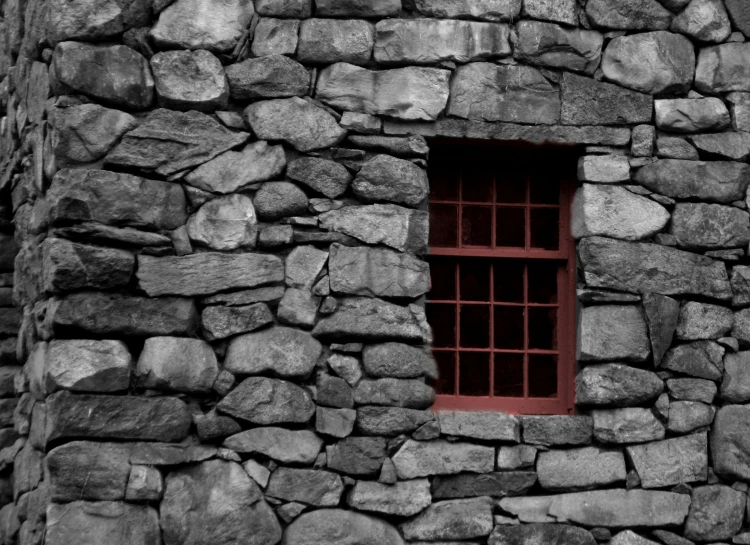 a window on a large stone building