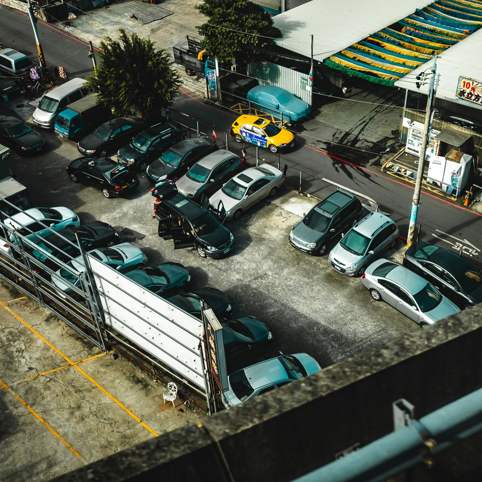 the aerial view of a parking lot with a truck in it