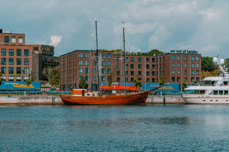 two boats in the water outside of some buildings