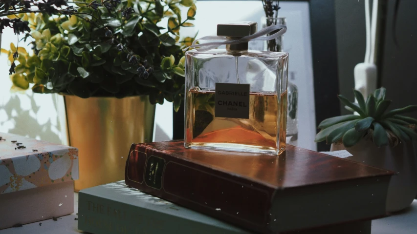 an old - fashioned perfume bottle is in a vase on a table
