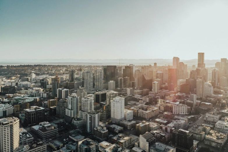 an aerial view of an urban city with high rise buildings and tall skyscrs