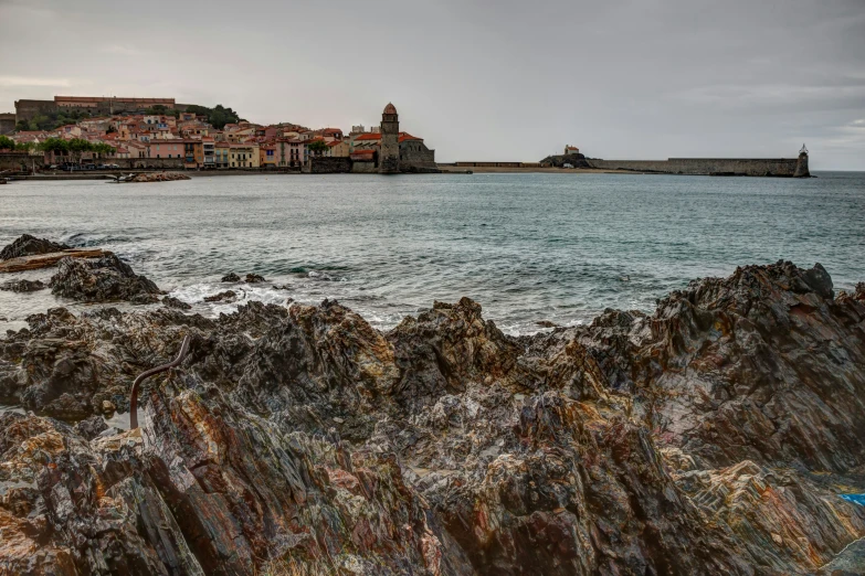 this is a picture of a seashore with rocks and some water