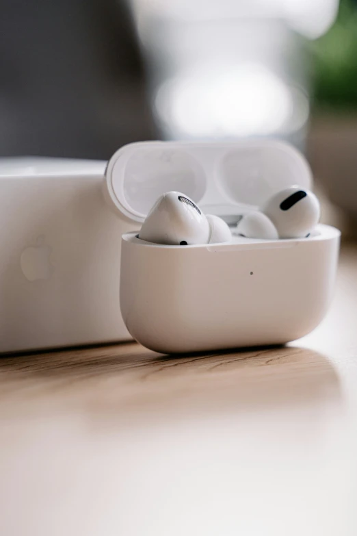 an apple earphones sitting on a white box