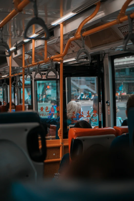 a public bus filled with people driving around