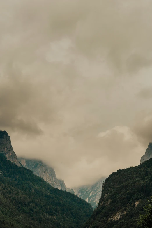 a picture of a mountain range on a cloudy day