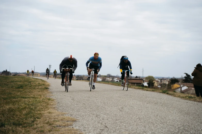 there are many cyclists on the path as people look on