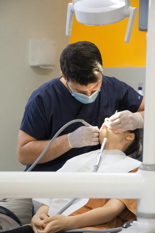 a person with a mask on holding a toothbrush