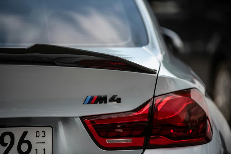 this is an image of the taillights on a silver bmw car