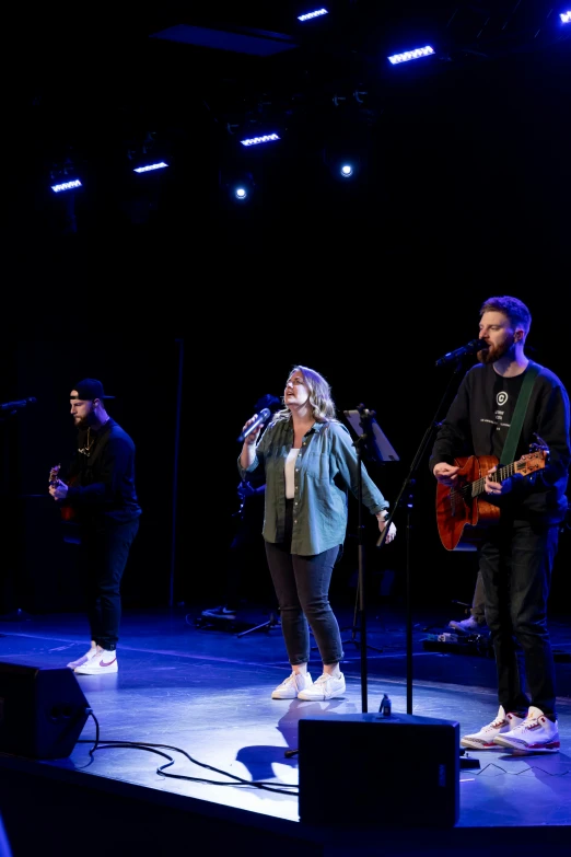 a group of people on stage playing music