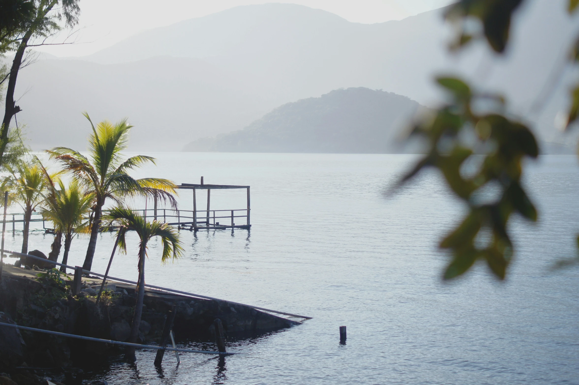 a body of water with a dock on top of it