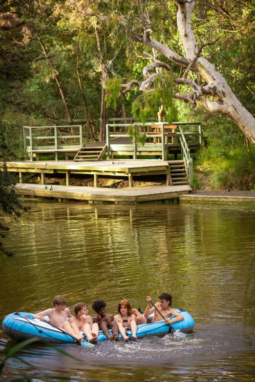 the s are floating on the raft in the water