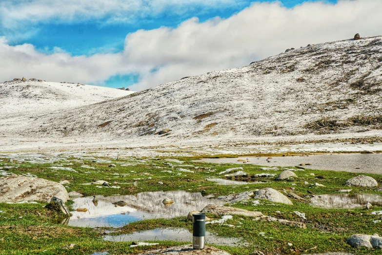 there are snow covered hills that appear to be barren