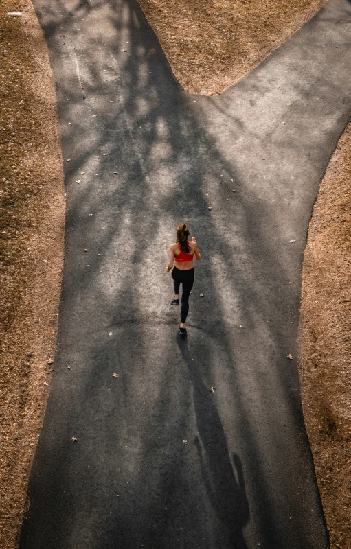 a person is running on the paved path