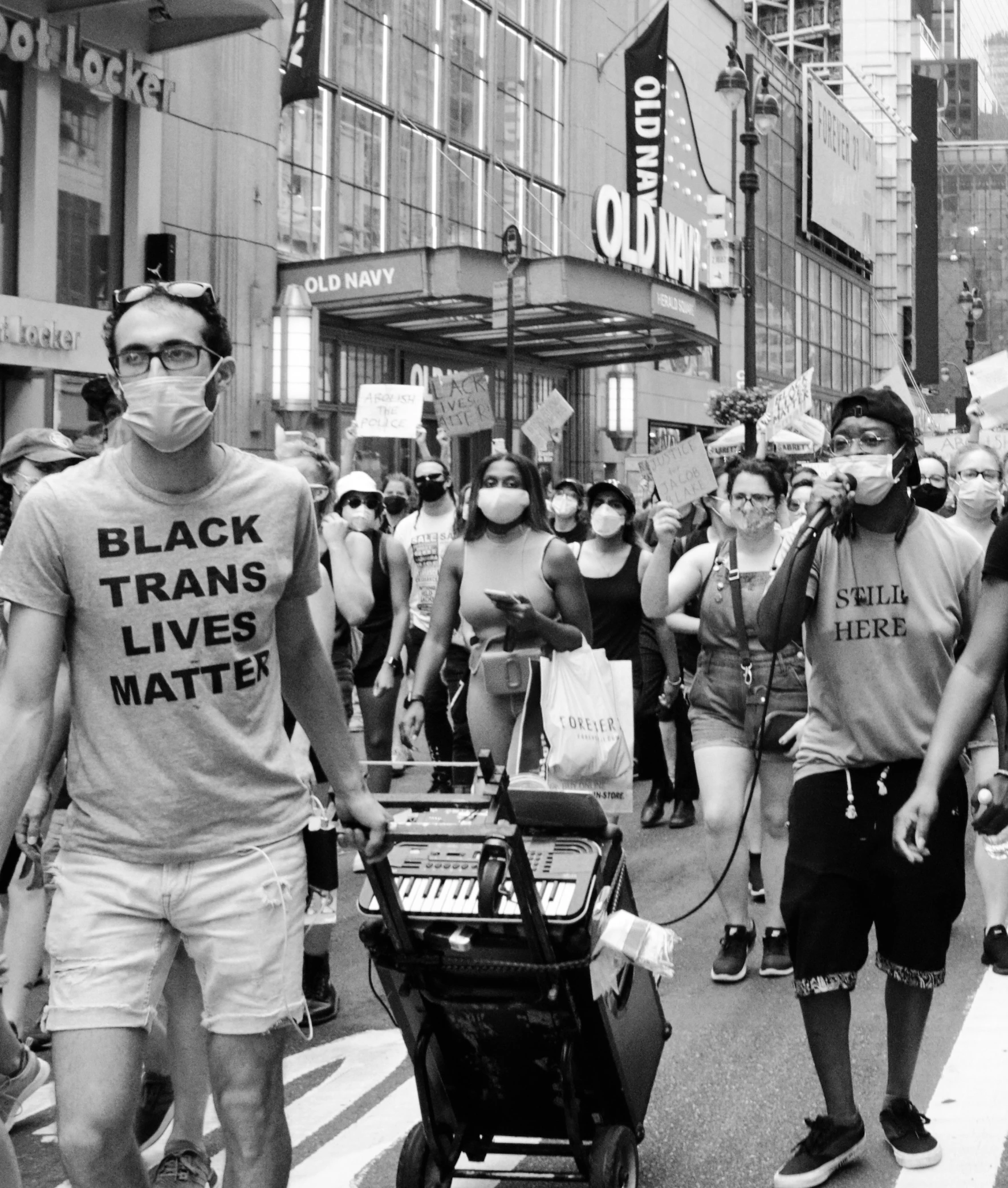 a black and white po of people in the street