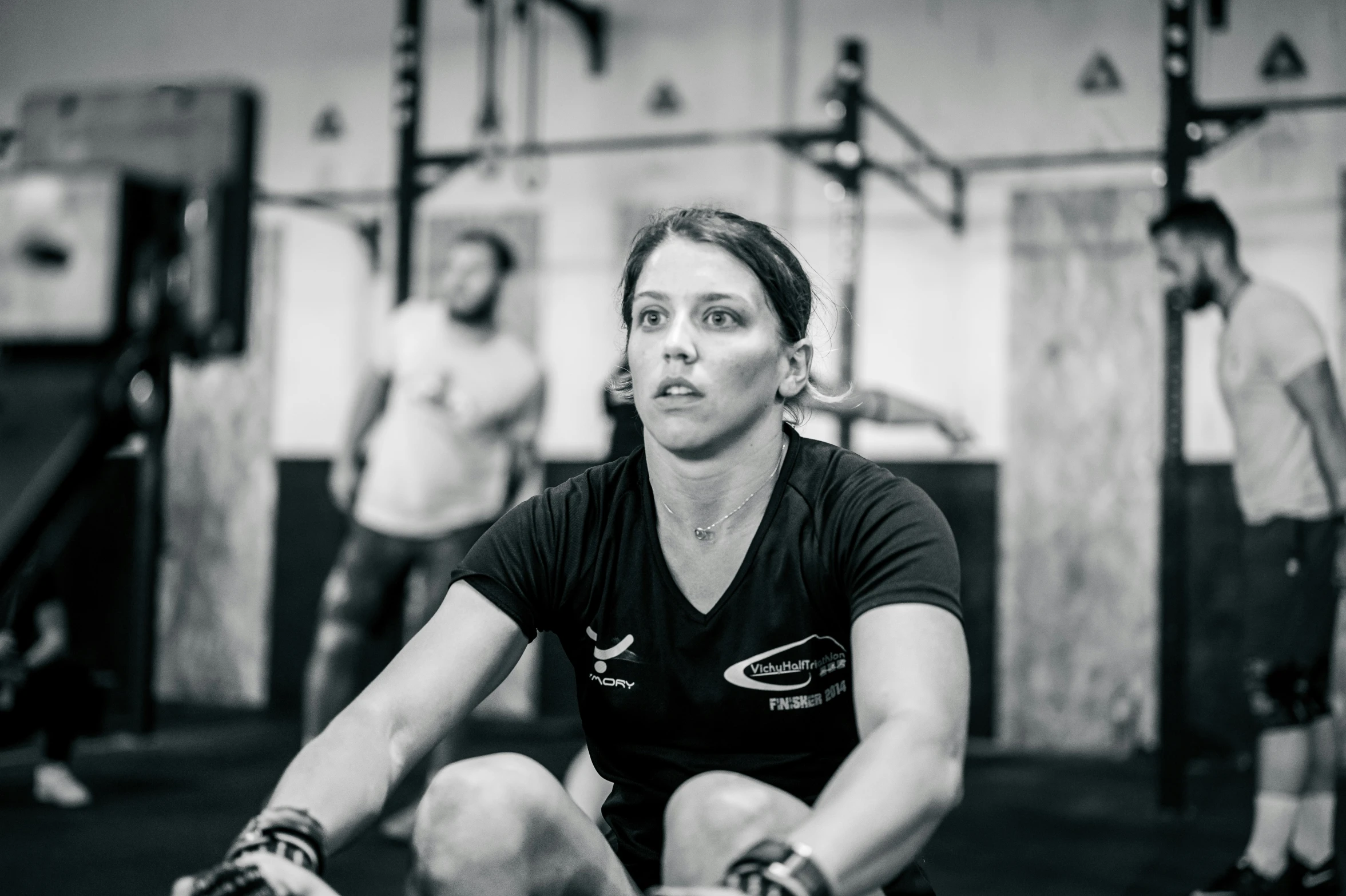 two people on a squat bench at the gym