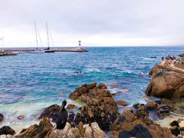 an ocean with people and boats in the water