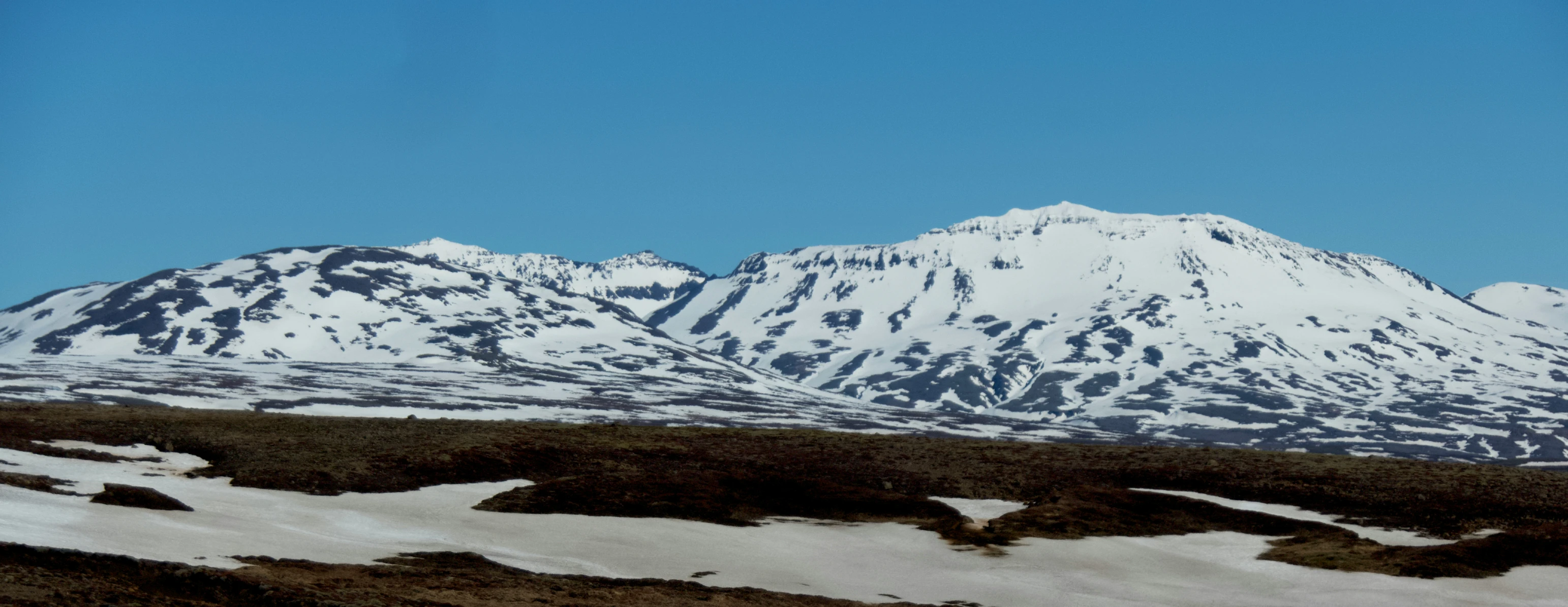 a large mountain with snow on top