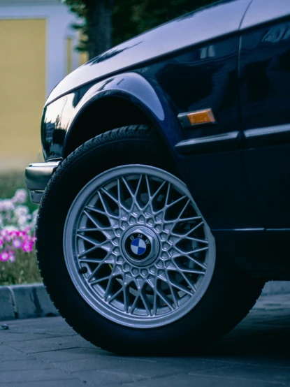the rims of a bmw are shiny and chrome