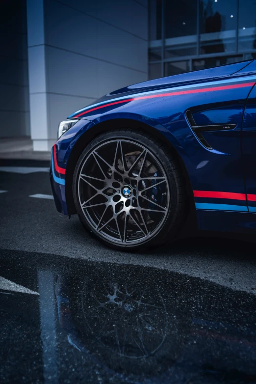 a blue sports car parked in a lot