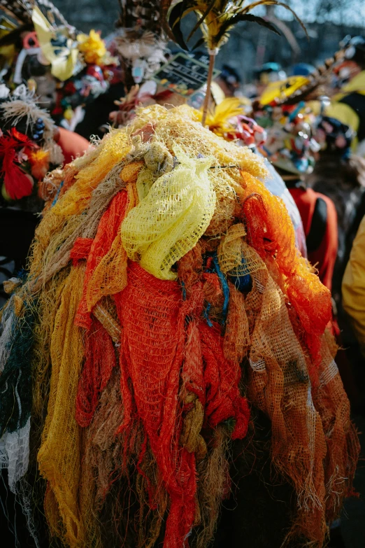 a head and neck piece of fabric wrapped in tulle