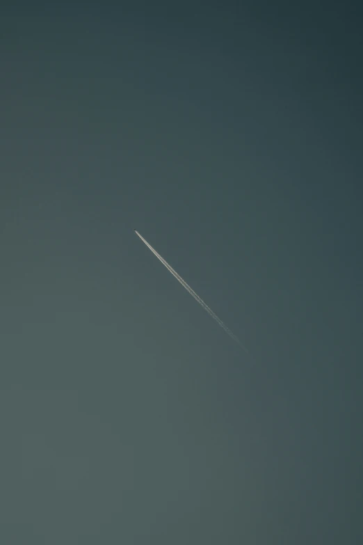 the jet is flying over the sky in daytime