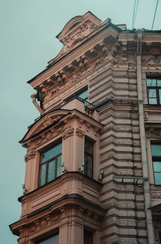 a very ornate building on the corner of an urban street