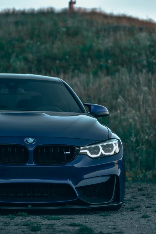 the front of a blue bmw bmw car