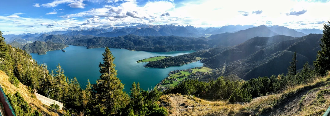 a view of mountains and trees and the sky