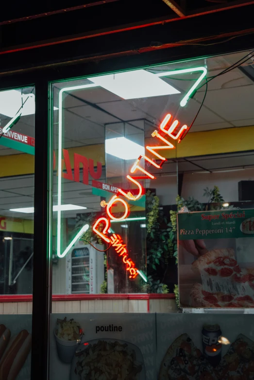 neon signs in the window of a fast food restaurant